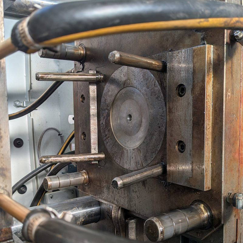 One side of a metal mould in an injection moulding machine