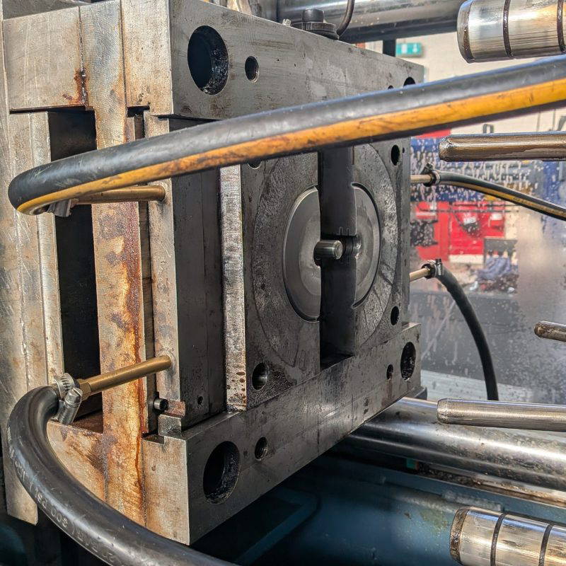 One side of a metal mould in an injection moulding machine